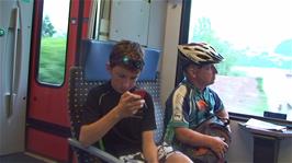 Will and John on the train from Brunnen to Lucerne after our 33.4 cycling miles from Hospental